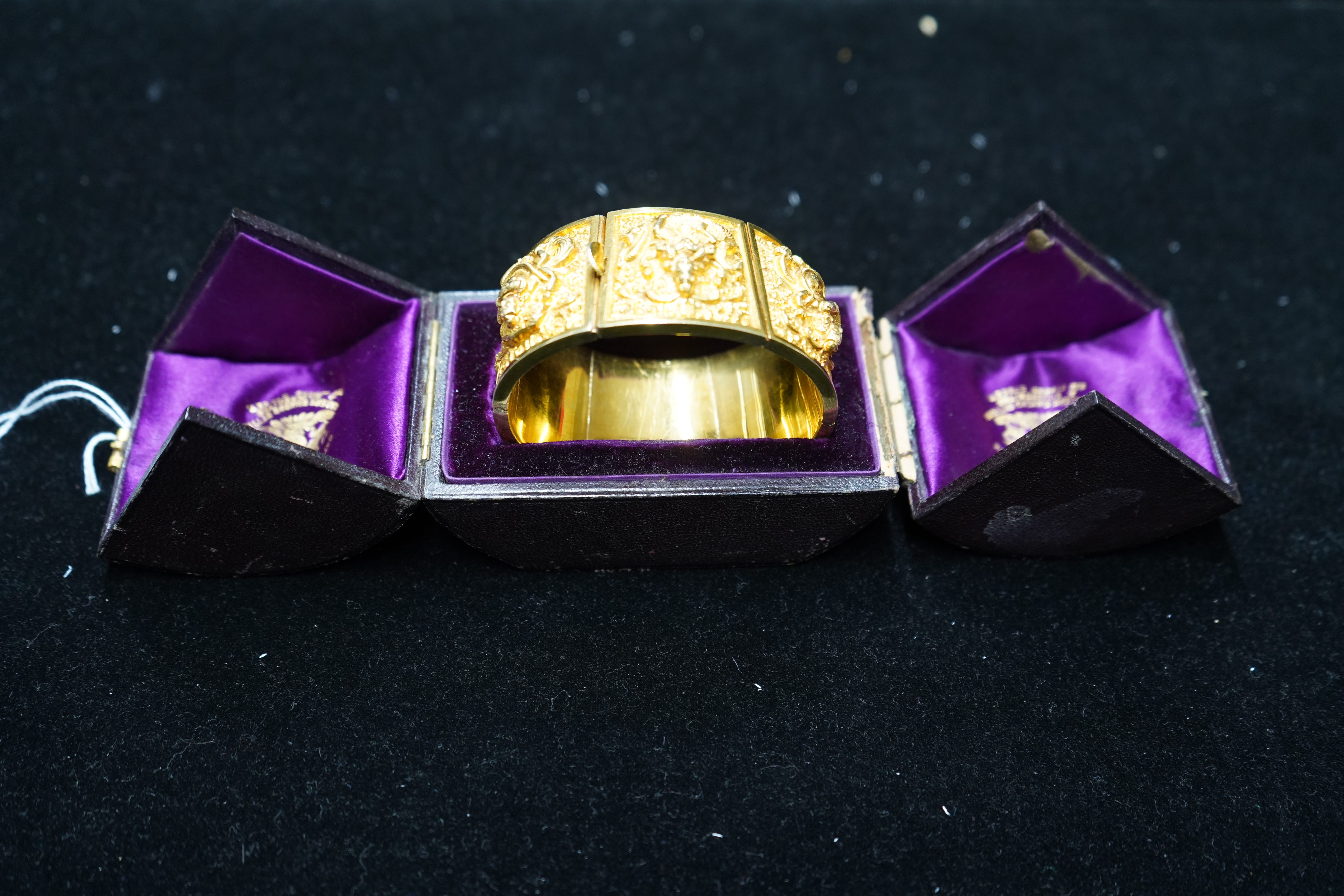 An early 20th century Indian gold hinged panelled cuff bracelet